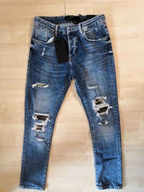 ripped jeans with camo patches