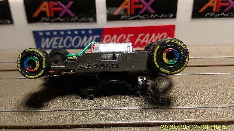 AFX RACING H.O. SCALE MEGA G+ 1.7 NARROW CHASSIS RAINBOW RIMS YELLOW P-ZERO TIRE