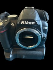 Nikon D 3000 SLR. Camera Body And Attached Battery Pack