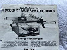 Ryobi 10 inch table saw / with  sturdy constructed stand / manual & blades.