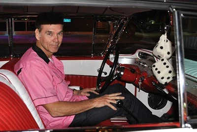 Ray Evernham behind the wheel of his restored 1958 Impala from American Graffiti.