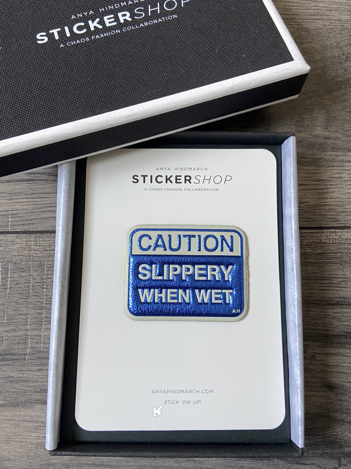 ANYA HINDMARCH METALLIC BLUE CAPRA LEATHER ""CAUTION SLIPPERY WHEN WET"" STICKER