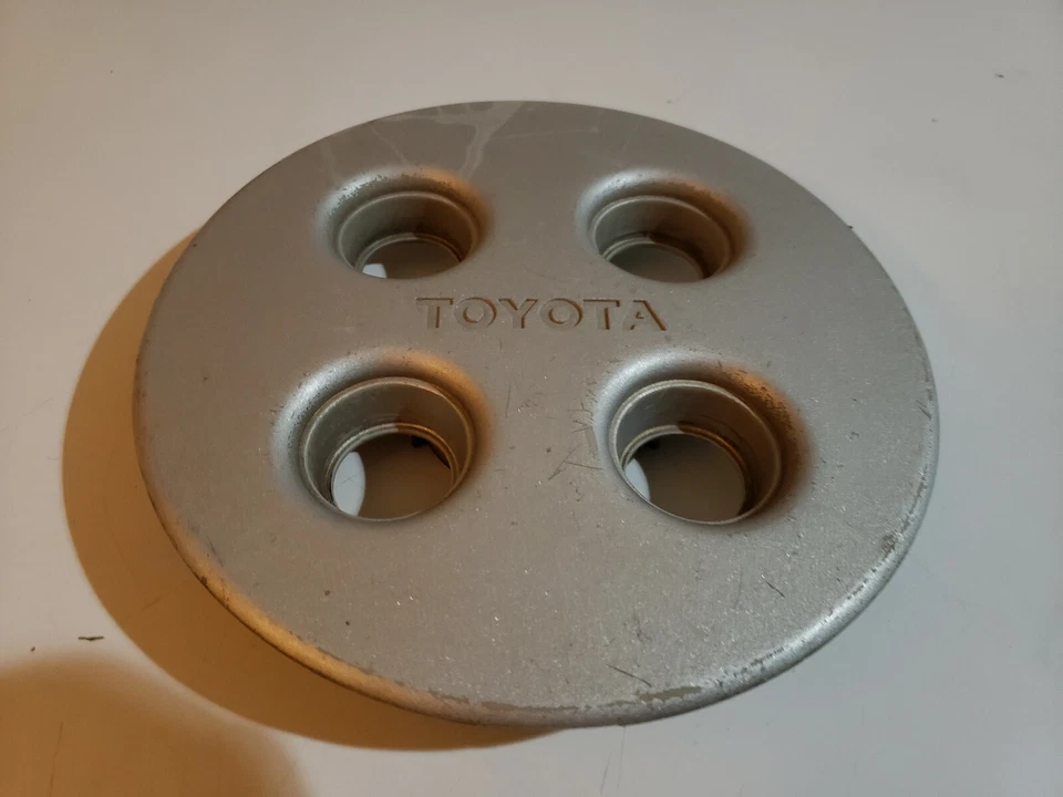 Tapa central de rueda Toyota Celica Corolla 1990 4 orejetas plateada OEM #BX12 Foto 2 de 3