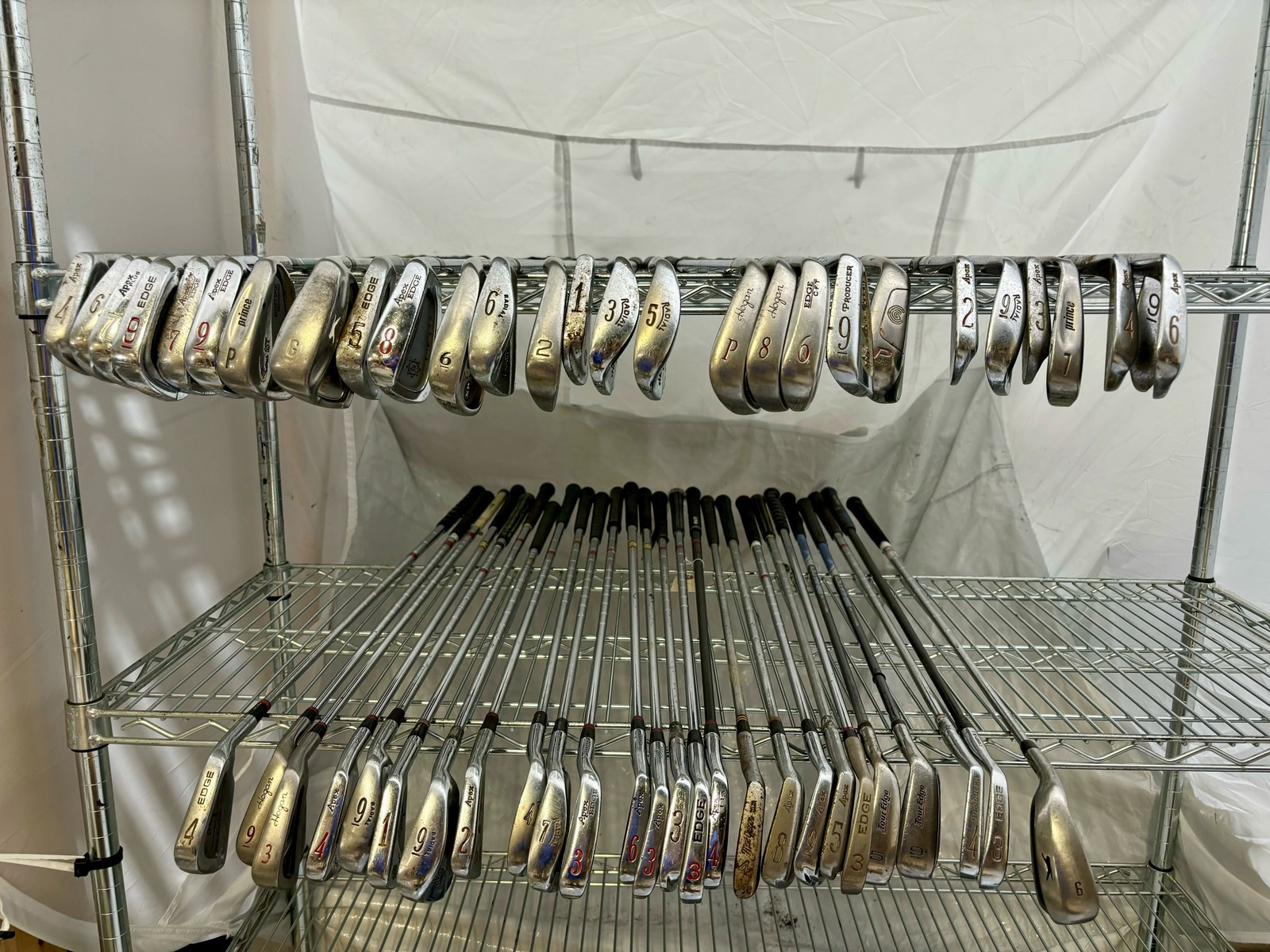 Wholesale Lot of 50 Golf Clubs - Assorted Single Irons and Wedges.