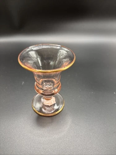 Pink Depression glass pedestal cup with gold trim