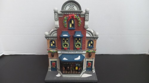 DEPT.56- CHRISTMAS IN THE CITY SERIES " SCOTTIES TOY SHOP". NO CORD. NO BOX.
