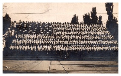postcard G.A.R. encampment women stands in line create American Flag RPPC  B1732