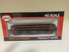 Flat car with guard rails and knuckle couplers 325