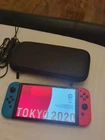 Nintendo Switch OLED with Carry Case and Mario and Sonic Olympic Games