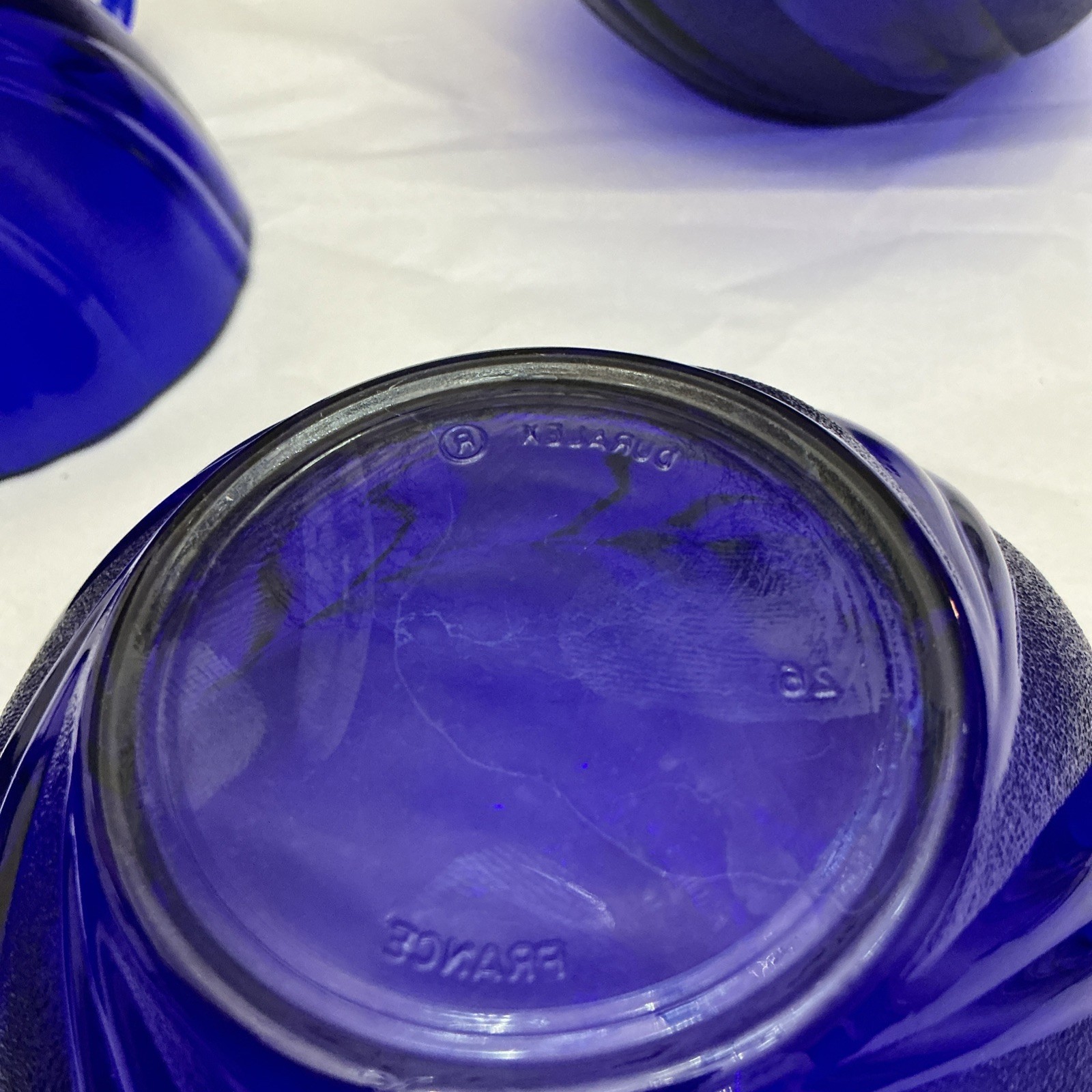 Four Pieces Of Cobalt Blue France Produced Serve Ware. 2 Berry Bowls And 2 Cups