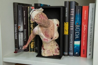 Add a spine-chilling touch to your bookshelf with this Nurse Statue Bookend