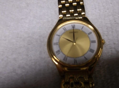 Seiko Watch Men 32mm White Dial God Tone Round V701