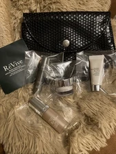 ReVive Deluxe Travel  Essentials 4 Piece   Sample Set with Pouch New