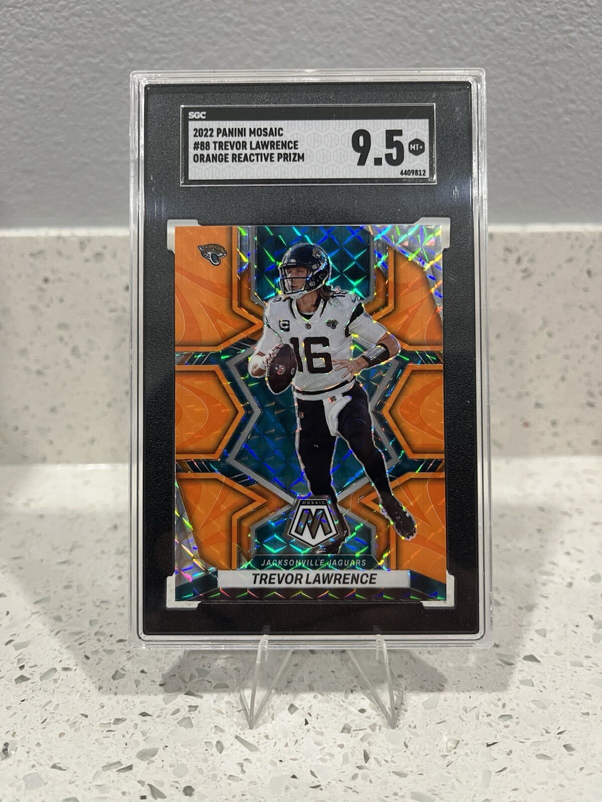 2022 Panini Mosaic - #88 Trevor Lawrence SGC 9.5 Orange Reactive Prizm