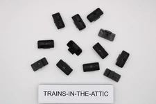 LIONEL POSTWAR BLACK PLASTIC COLLECTOR SLIDE SHOE. TT-208. NEW. P ACK OF (12)