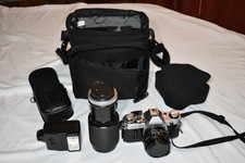 Canon AE-1 35mm SLR Body W/ 2 Lens, Flash, Bags, Covers.