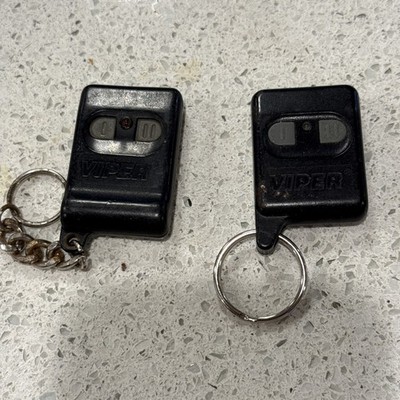 A pair of OLD SCHOOL DEI VIPER ALARM REMOTE  2 button 