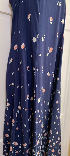 Navy blue midi dress with small white floral print, scoop neckline, and “E.D. Michaels 80s USA Made” label on hanger.