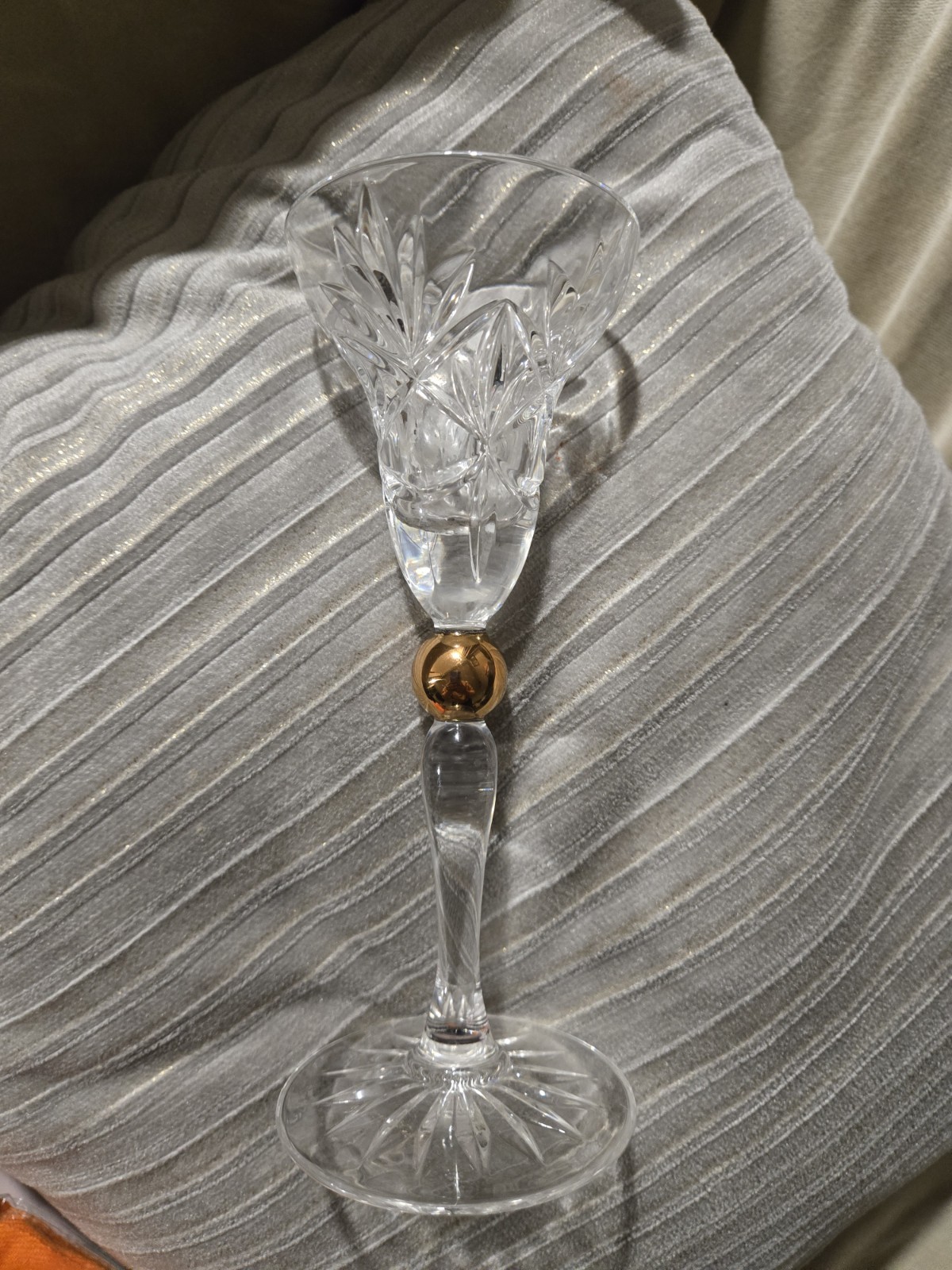 Vintage cut crystal candlestick with a flared bowl and gold ball accent in the stem