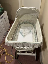 vintage wicker baby bassinet on wheels