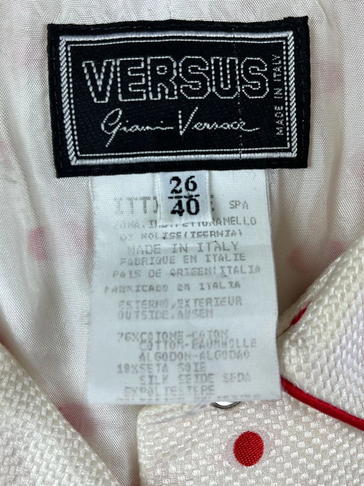 Abito Gianni Versace Versus anni 90 senza maniche a pois con bottoni bordo rosso colletto si