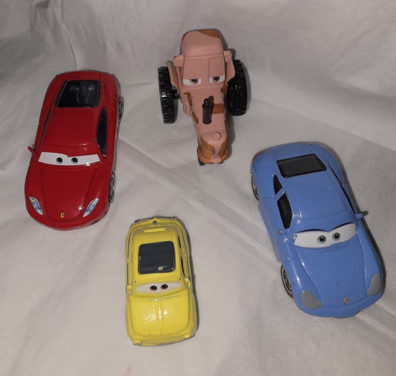 Disney/Pixar Cars Lot of 4 Die-cast Luigi Fiat 500, Porsch, Chewell Tractor 