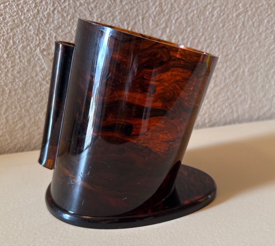 Amber tortoiseshell Lucite wine bottle holder that's equal parts Art Deco sculpture and conversation piece.