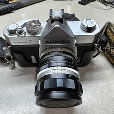 Konica Autoreflex T Film Camera w/ Hexanon AR 52mm F1.8 Lens. Carrying strap.