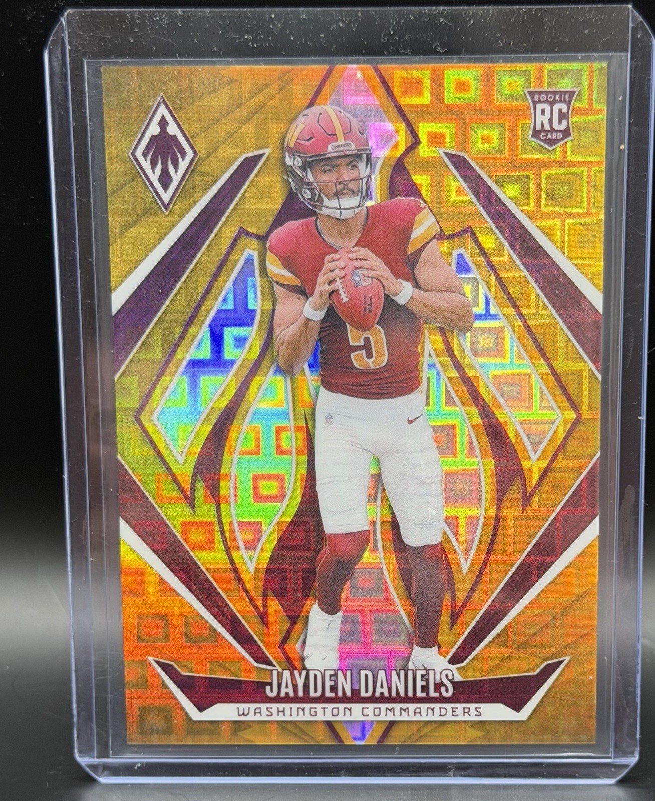 2024 Panini Phoenix - Rookies Jayden Daniels #198 Gold Pandora 02/10 (RC)