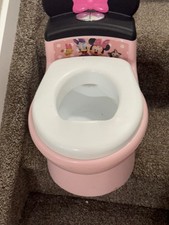 little girls pink mickey Mouse potty chair it so cute, it makes a flushing sound