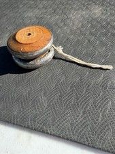 vintage yo-yo featuring wooden sides and pewter or metal rims T9