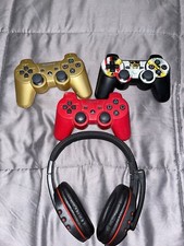 playstation 3 controllers and headphones