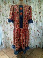 Multi coloured Panto Dame, Blue ribbon 46" chest, Orange buttons