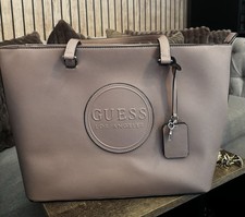 Image of Guess Jaxon Travel Tote handbag in a dusty mauve color