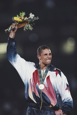 American decathlete Dan O'Brien celebrates on the medal podium aft- Old Photo