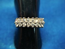 PRETTY STERLING SILVER RING WITH 16 ROUND STONES