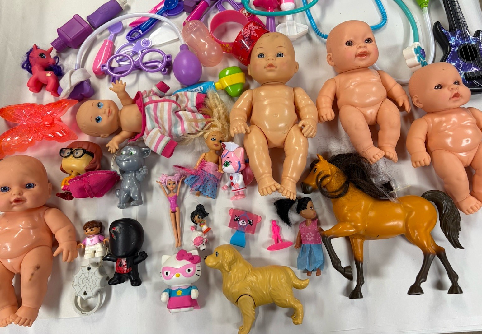 Assortment Of Baby Dolls And Accessories