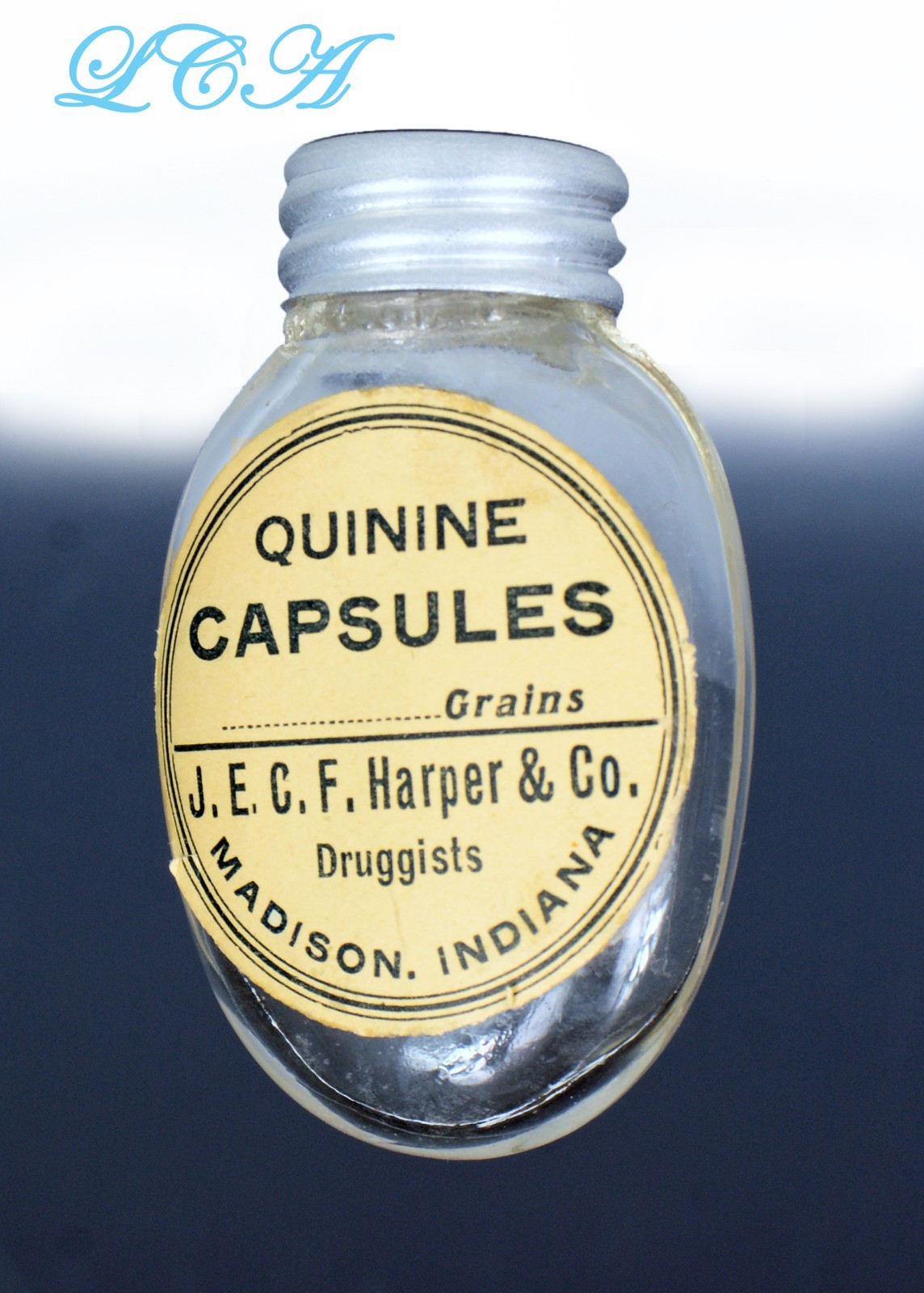 Tiny oval QUININE CAPSULTE antique PILL BOTTLE from MADISON INDIANA blown BIM