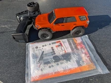 Axial 1/24 SCX24 Toyota 4Runner  Orange 4X4 RTR Brushed Rock Crawler - Open Box