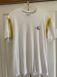 white shirt with yellow sleeves