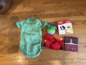 Lot 5 Dog items warm coverup, paw ornament, chew toy, hair remover,hat