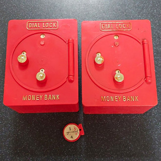 2 Vintage Red plastic Dial Lock Money Boxes with codes.