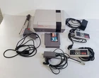 Y-230 VINTAGE NES CONSOLE BUNDLE-CONTROLLERS, POWER CORD, LAZER GUN, GAME, +!