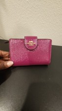 Coach Magenta Corner Zippy Compact Wallet with golden zipper and hardware