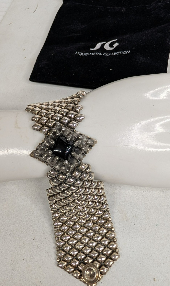 A ) Vintage S G Liquid Metal Collection Bracelet Bagged