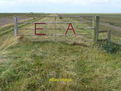 Photo 12x8 E A on a five barred gate on the sea bank Environment Agency ga c2012
