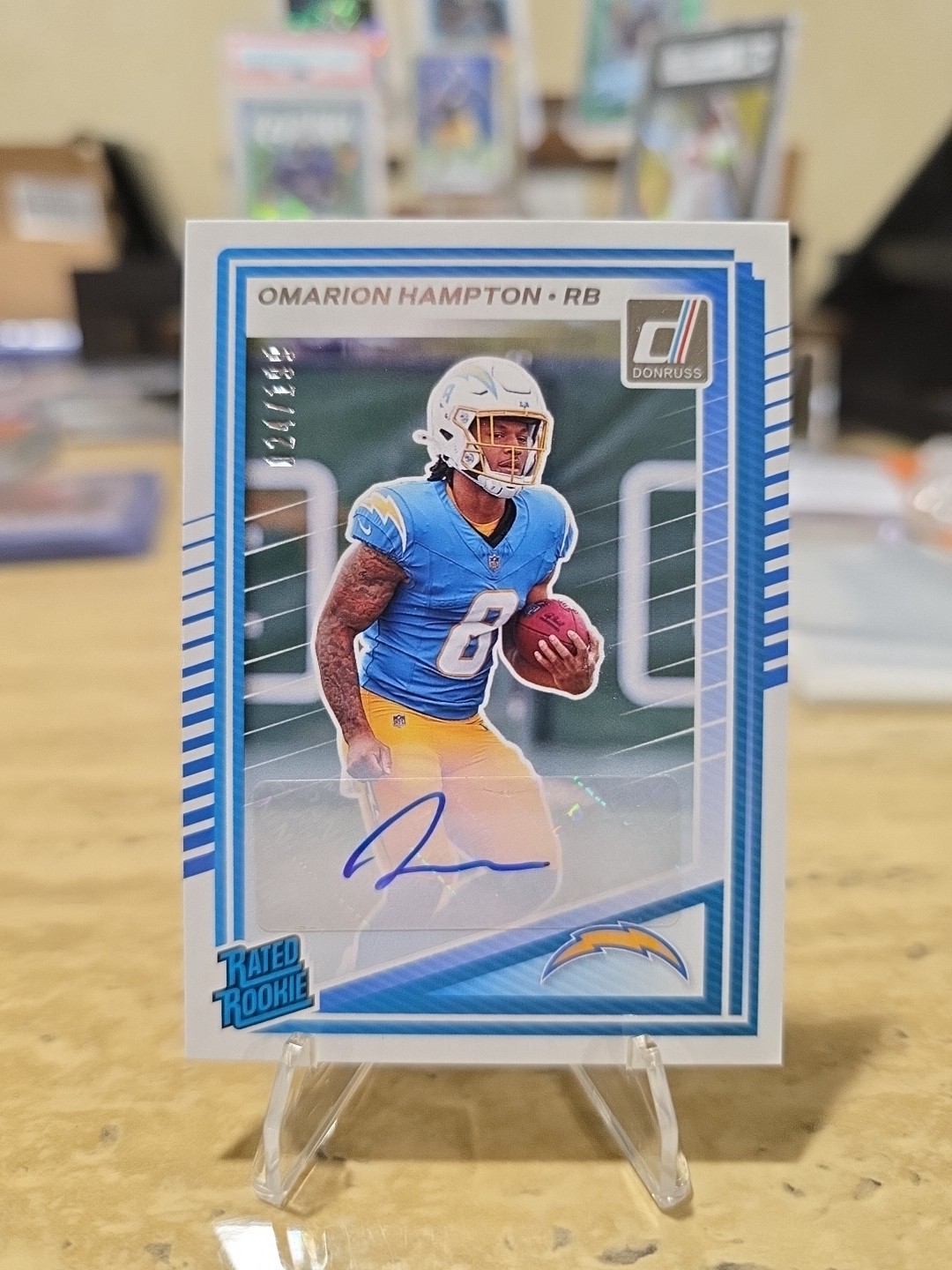 2025 Panini Donruss Omarion Hampton Rated Rookie Auto /199 #303 Chargers