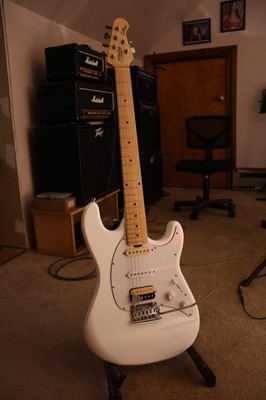 Sterling cutlass, locking tuners, Fender and Gibson pickups.
