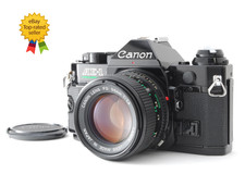 Appareil photo argentique noir Canon AE-1 Program NFD 50mm f/1.4 Objectif...