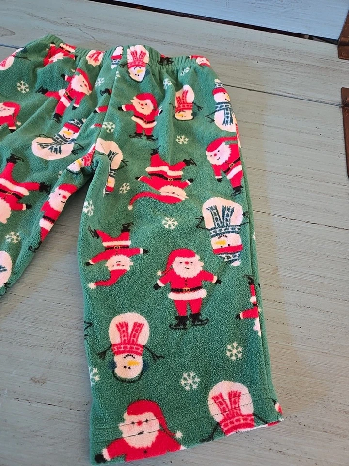Pantalones de pijama CARTER'S verde polar estampado de Papá Noel y muñeco de nieve niños niñas talla 12 meses Foto 3 de 4